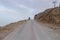 Lonely figure of a man on a mountain road