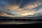 Lonely fisherman in canoe on Sepik river in Papua New Guinea during dusk