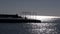 Lonely fisherman silhouette in Rhodes port, Greece
