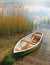 Lonely fishing boat at the lakeside