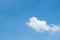 Lonely fluffy cloud on the clear blue sky