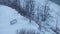 A lonely frozen bench sits alone by a pond in Winter