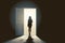 lonely girl stands in front of an open door on a gray wall