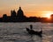 Lonely gondola on Grand Canal in Venice at sunset, Italy. Romantic scene