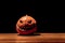 Lonely halloween pumpkin smile with black dark fire eyes mouth