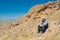 Lonely hiker having short rest on Kara-dag natural reserve, Eastern Crimea