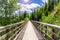 Lonely Hiker on a Mountain Path and Blue Sunny Sky