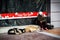 A lonely, homeless, alcohol-dependent woman sitting in front of the showcases with New Year`s decoration with two street dogs.Sofi