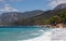 Lonely house on the Mediterranean coast, white waves, high mountains