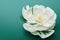 Lonely large white peony flower with core lying on green table.