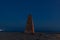 Lonely lighthouse and the milky way in the night starry sky