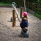 Lonely little girl on a playground