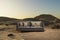 lonely living room couch in large desert environment immersion entertainment movie concept 3D illustration