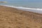 Lonely, lost beach slippers by the sea