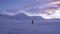 A lonely, lost traveler goes by a strong storm in Svalbard. Strong wind.