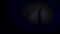 A lonely man exploring deep dark cave. Stock footage. Silhouette of a person standing inside of the cave on the