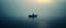 A lonely man sitting in a boat in the middle of a vast lake. Dark foggy, misty wheather, overcast.