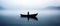 A lonely man standing in a boat in the middle of a lake. Overcast, foggy wheather