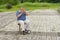 Lonely musician on a street playing woodwind instrument sopilka