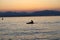 Lonely paddler on the lake during the sunset