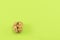 Lonely peeled walnut on green background