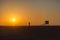 Lonely people enjoying a nice sunset in Huntington Beach, California, USA