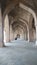 Lonely person sitting in solace in the ruins of an old indian palace