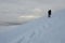 Lonely photographer with tripod making winter trekking,Ukraine