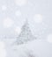 Lonely pine tree in heavy snow fall middle of winter