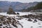 Lonely Pine tree on rock on Altai river Katun in winter. Rocks called Dragon\\\'s teeth, Dragon crest, or Sartakpai Arrows