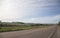 Lonely road in the countryside with blue sky