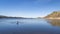 Lonely rower in a coastal rowing shell - Carter Lake in fall or winter scenery in Colorado