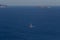 Lonely sailboat cruising the aegean sea, Santorini island, Cyclades, Greece