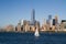 Lonely sailboat in front of New York downtown