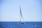 Lonely sailboat in the open sea. Romantic trip. Travel.