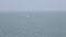 A lonely sailboat in the waters of Atlantic Ocean. Portuagal