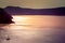 Lonely sailing boat in the vastness of aegean sea, Santorini.