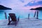 Lonely scene ; Single wooden chair in the port over sea at twilight