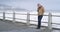 Lonely senior man depression at sea promenade, coast and beach on cold winter morning outdoor. Sad, stressed and mental