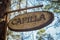 Lonely sign that reads `Capilla` in the forest