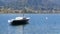 Lonely small boat at anchor in beautiful picturesque mountain area on Lake Tegernsee, Bavaria