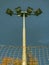 Lonely stadium light or lamp post with Union of light bulb stand alone with clould and blue sky