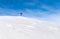 Lonely Summit Cross on windswept snow mountain with blue Sky. Rangiswanger Horn, Alps, Allgau, Bavaria, Germany.