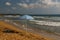 Lonely sunshade on the desert beach