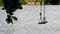 Lonely swings on water background