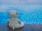 Lonely Teddy Bear Sitting near Swimming Pool