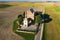 A lonely temple in the middle of a wheat field. Shot from above.