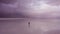 Lonely Tourist Man and Uyuni Salt Flats. Aerial View. Bolivia