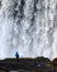 Lonely tourist near gorgeus Dettifoss waterfall