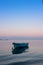 Lonely traditional greek fishing boat on sea water